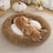 Round striped faux fur pet bed in dark grey for cats