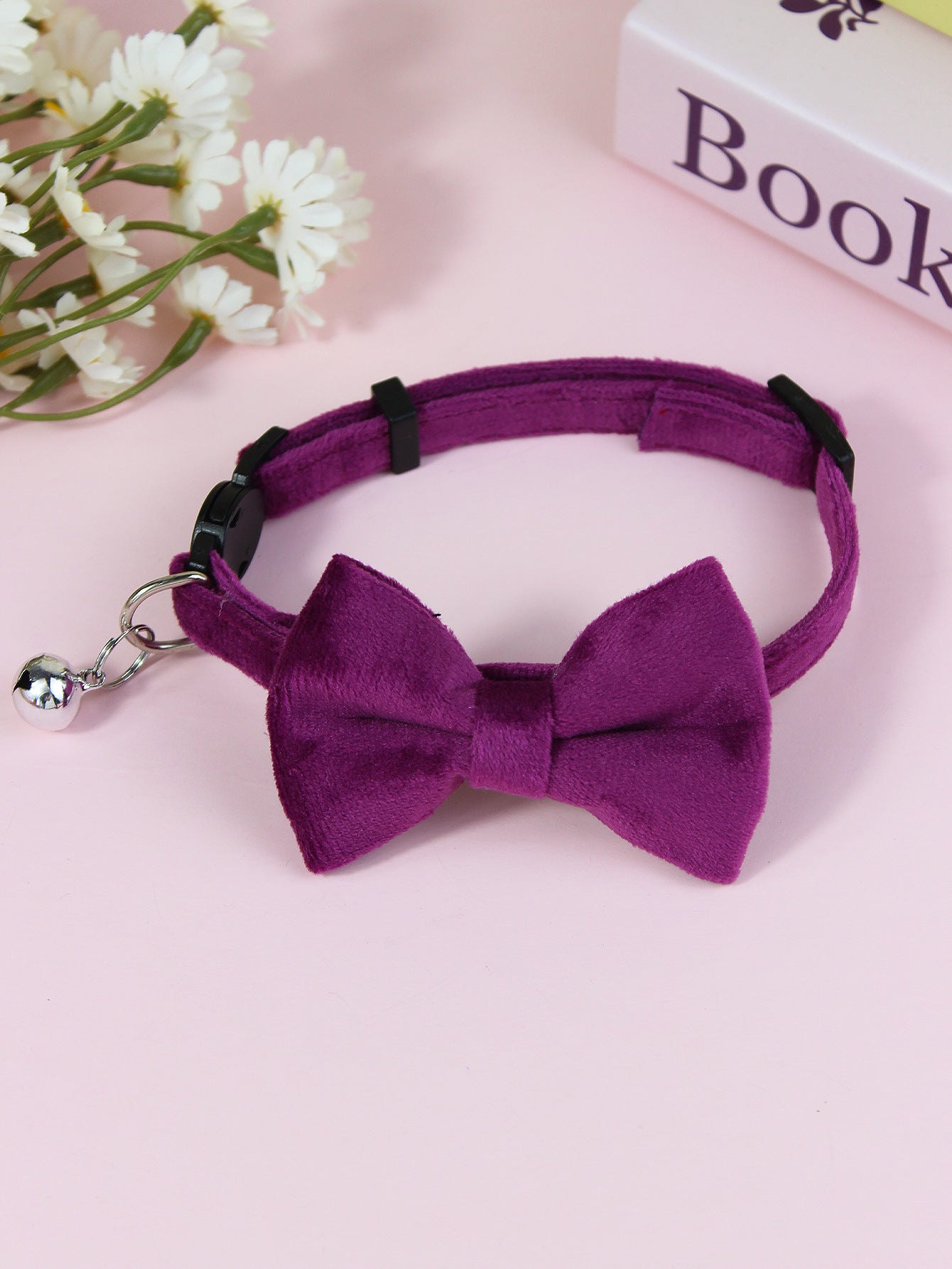 Striped cat collar with velvet bow, available from Pet Royale UK