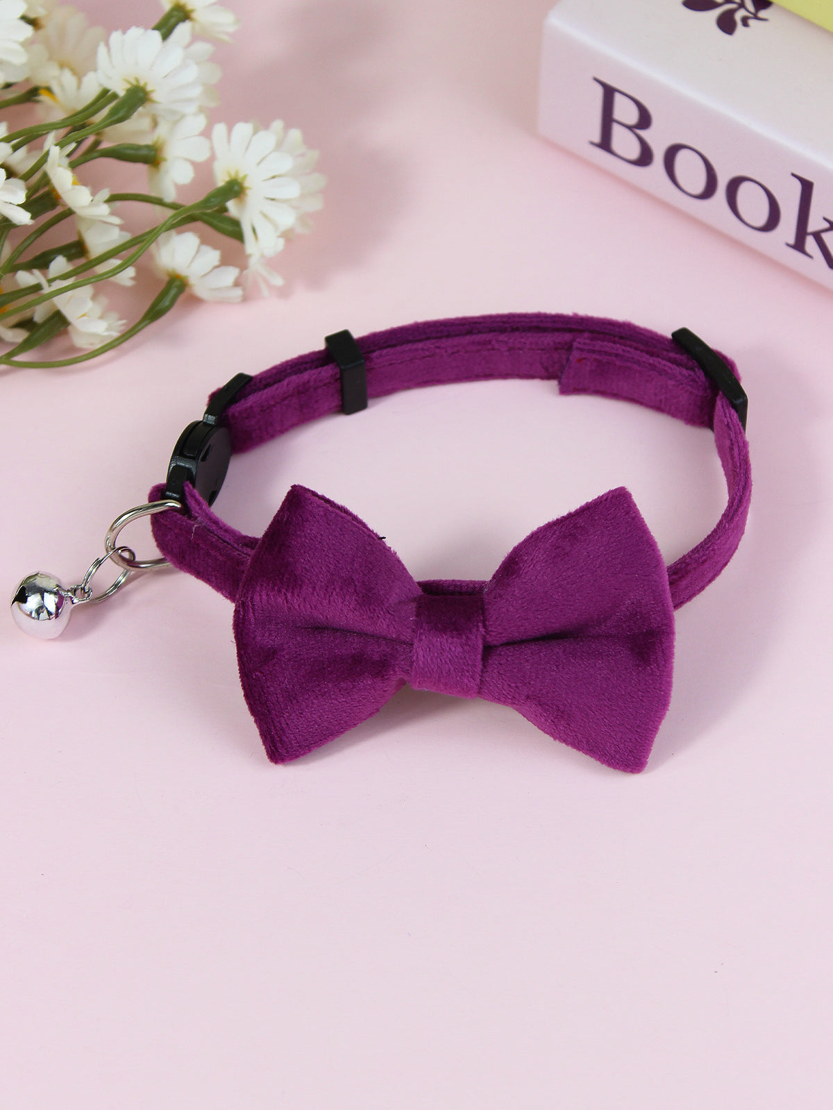 Striped cat collar with velvet bow, available from Pet Royale UK