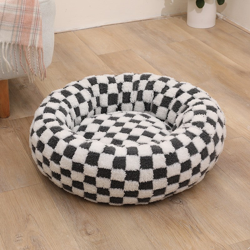 Plush round pet bed in check and floral prints, extra detail view