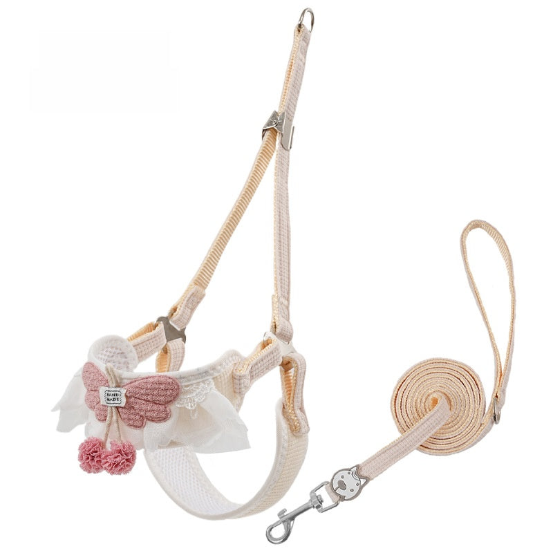 Floral vest harness and lead set in pink on a small dog