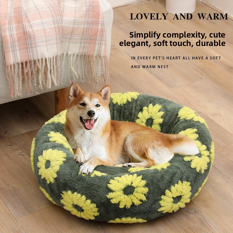 Plush round pet bed in check and floral prints, close-up detail view