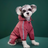 Small dog in a yellow hooded reflective four leg raincoat