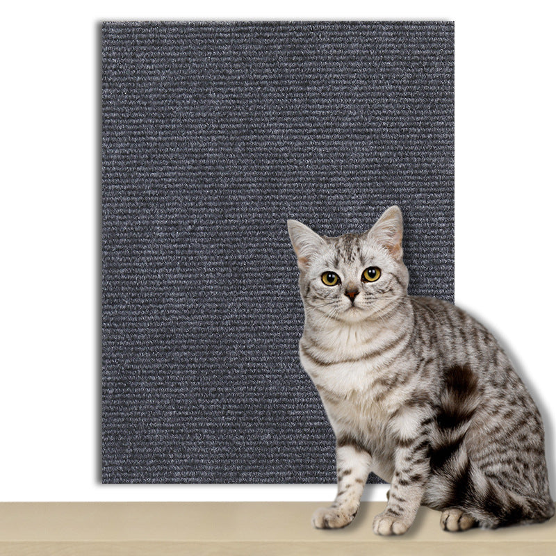 Dark blue cuttable scratch mat protecting a sofa