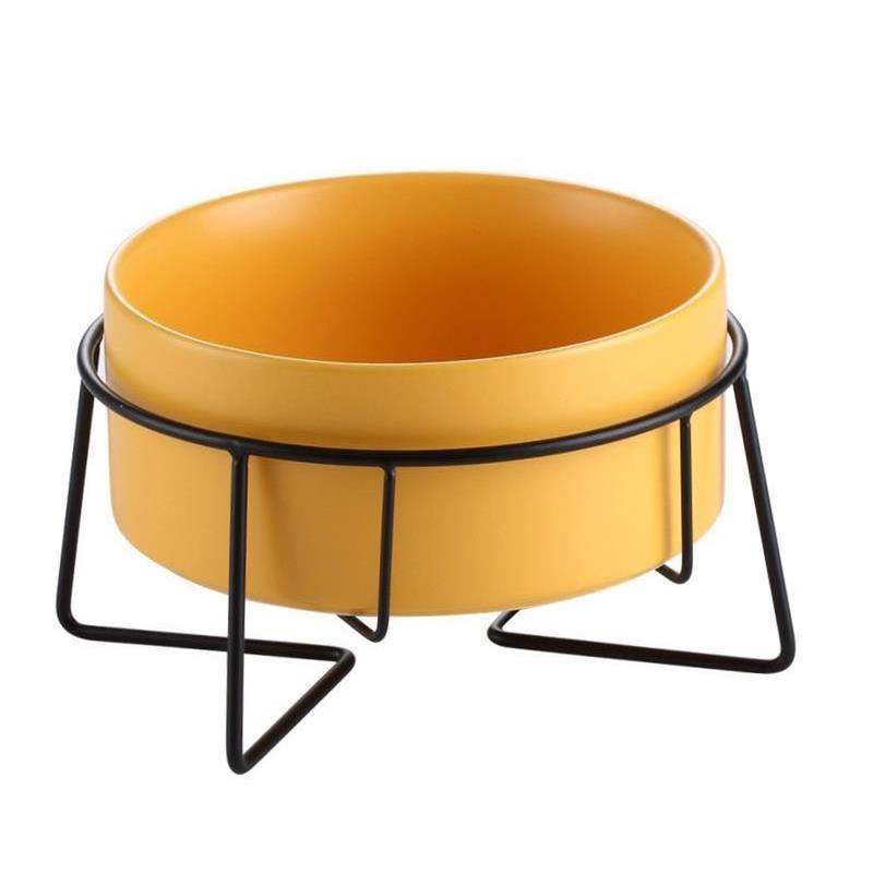 Raised glazed ceramic pet bowl on a stand in pastel yellow, view 4