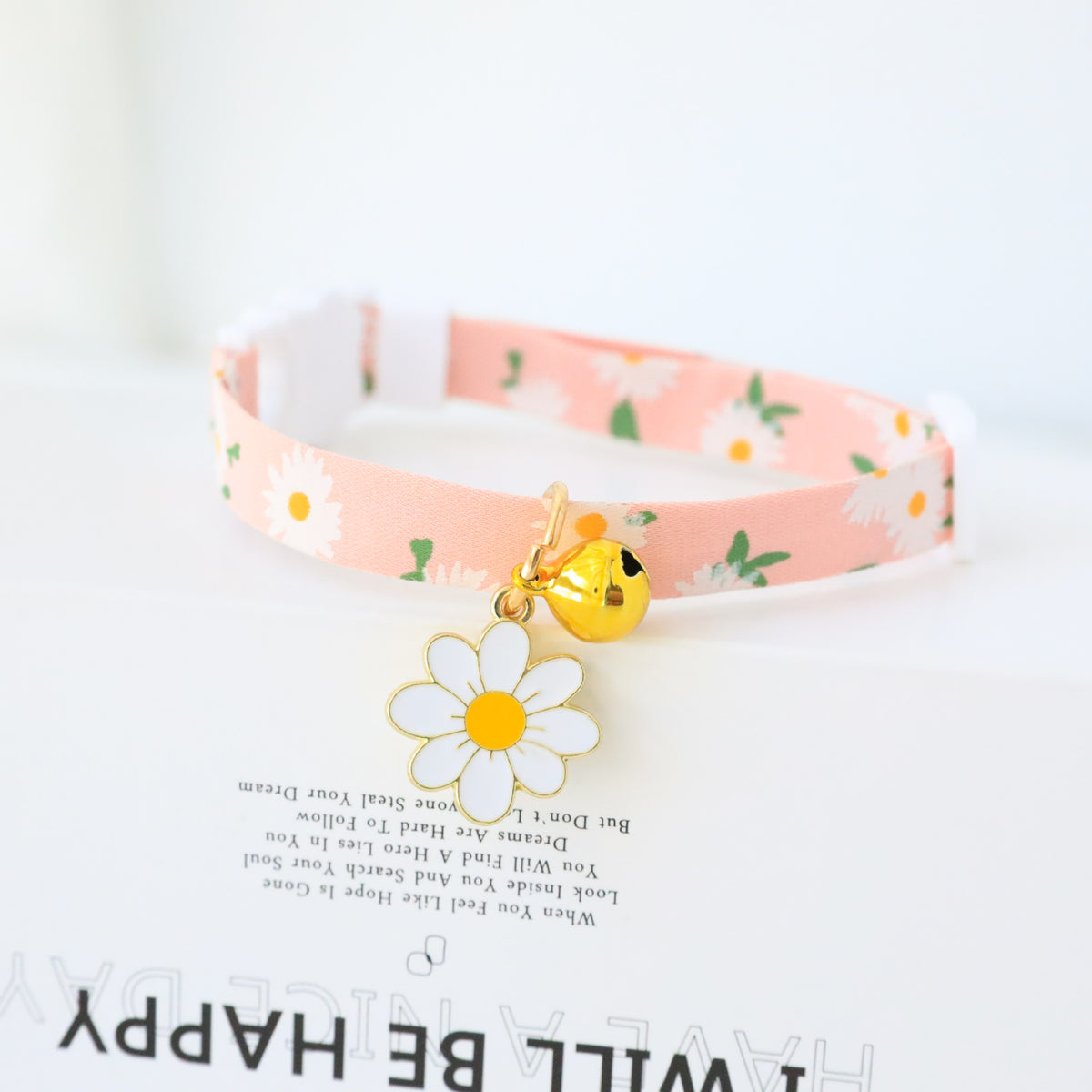 Floral cat collar with bell and safety buckle in Purple, close-up detail