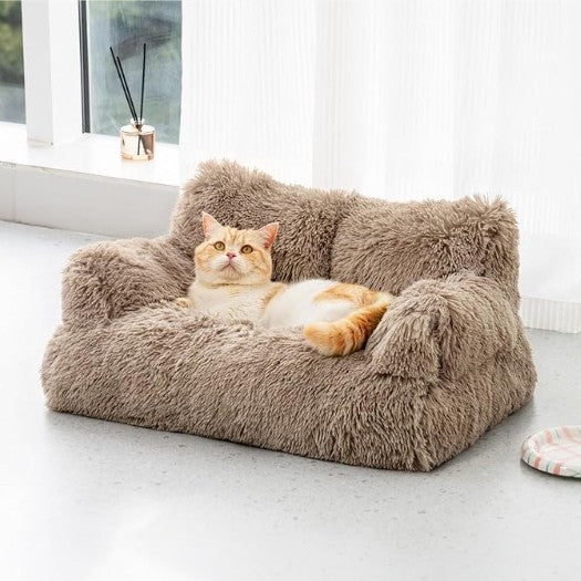 Beige velvet pet sofa bed with raised bolster for dogs and cats