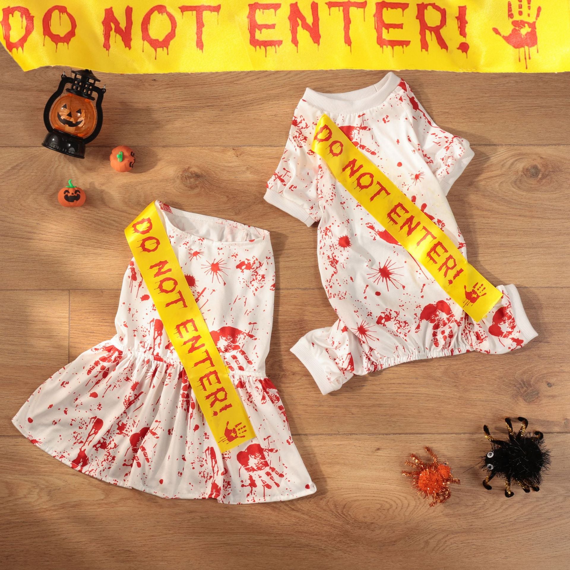 Small dog wearing a blood splatter print Halloween costume