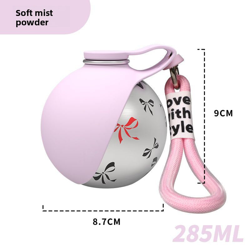 Collapsible stainless steel pet water bottle, in use with a pet