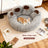 Grey bear paw shaped round plush pet bed, view 1