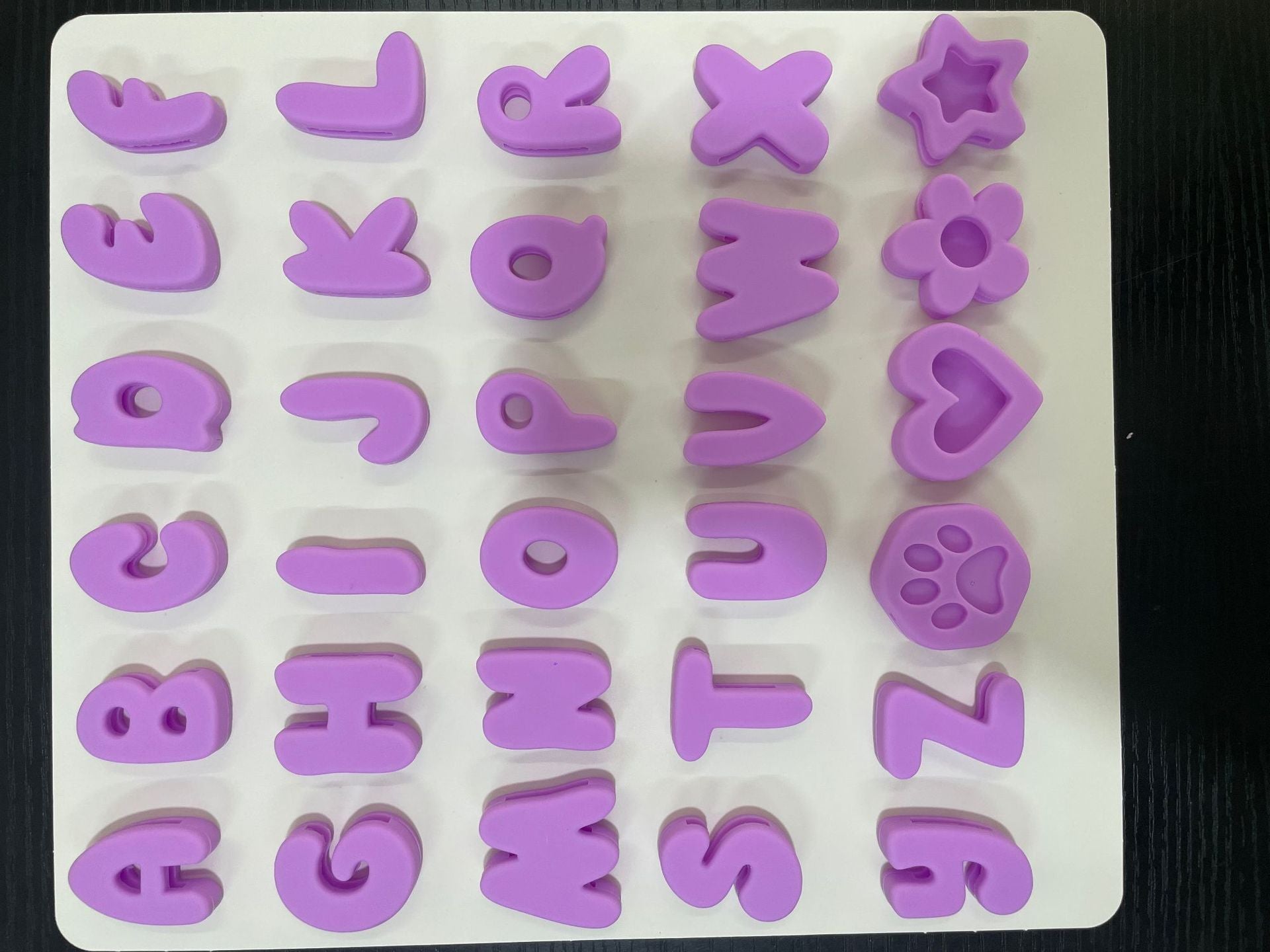 Silicone letter slides for pet collars, close-up detail view
