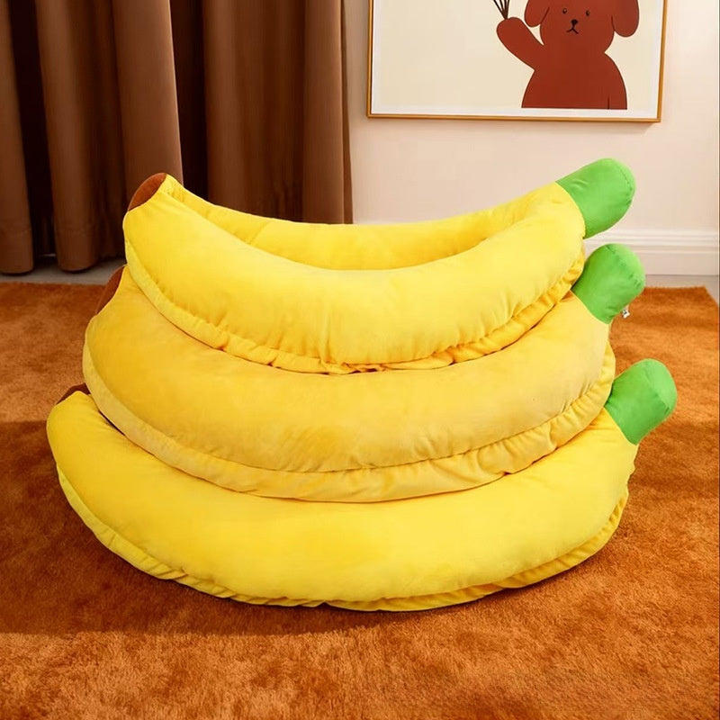 Banana shaped plush pet bed with cat curled inside, photo 3