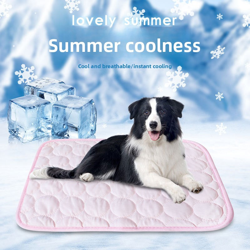 Dog lying on a large grey ice silk mat