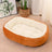Green oval dog bed in 70 by 55cm size