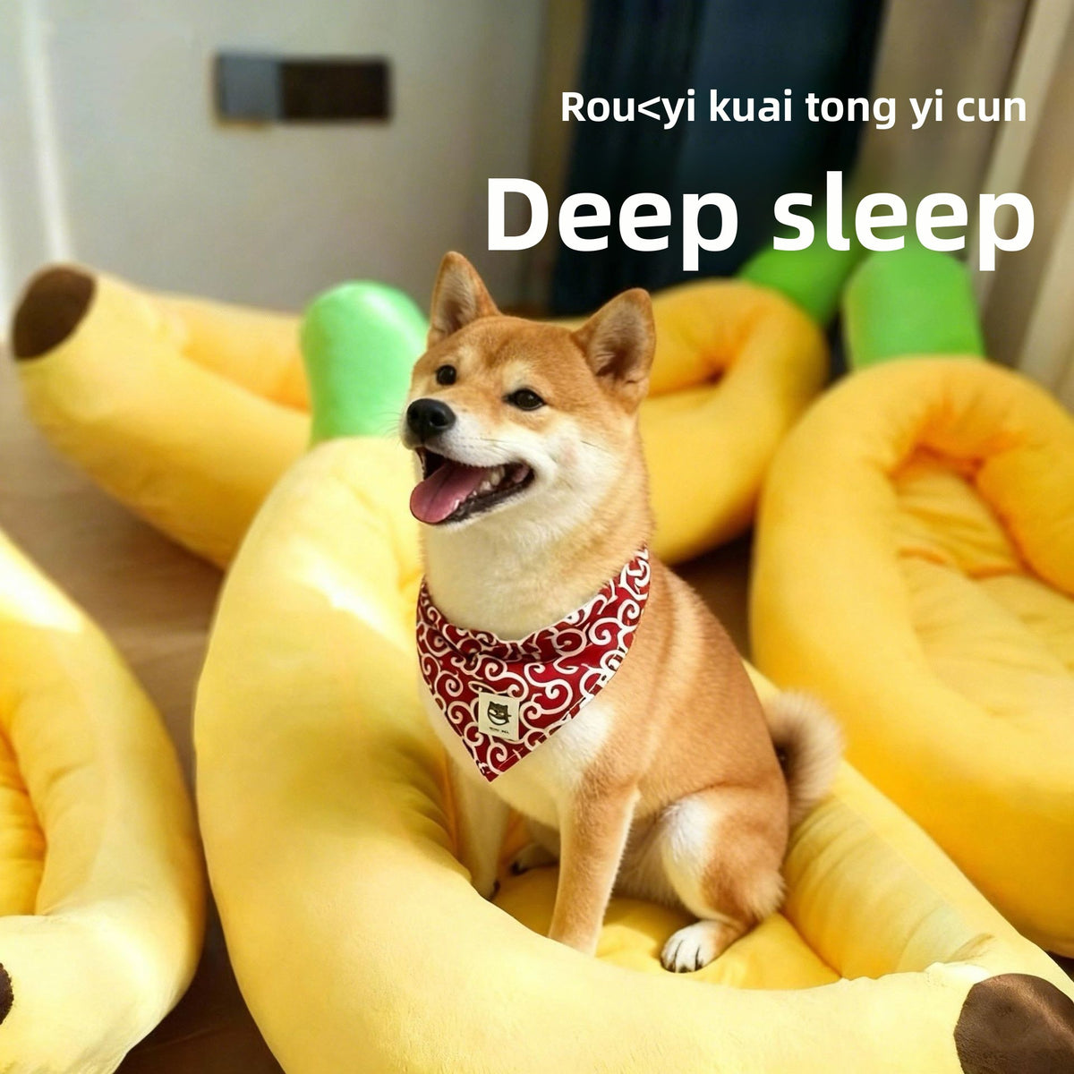 Banana shaped plush pet bed with cat curled inside