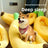 Banana shaped plush pet bed with cat curled inside