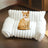 Grey plush pet sofa bed with raised sides for cats and dogs
