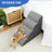Grey foam pet stairs placed at the side of a bed for a small dog