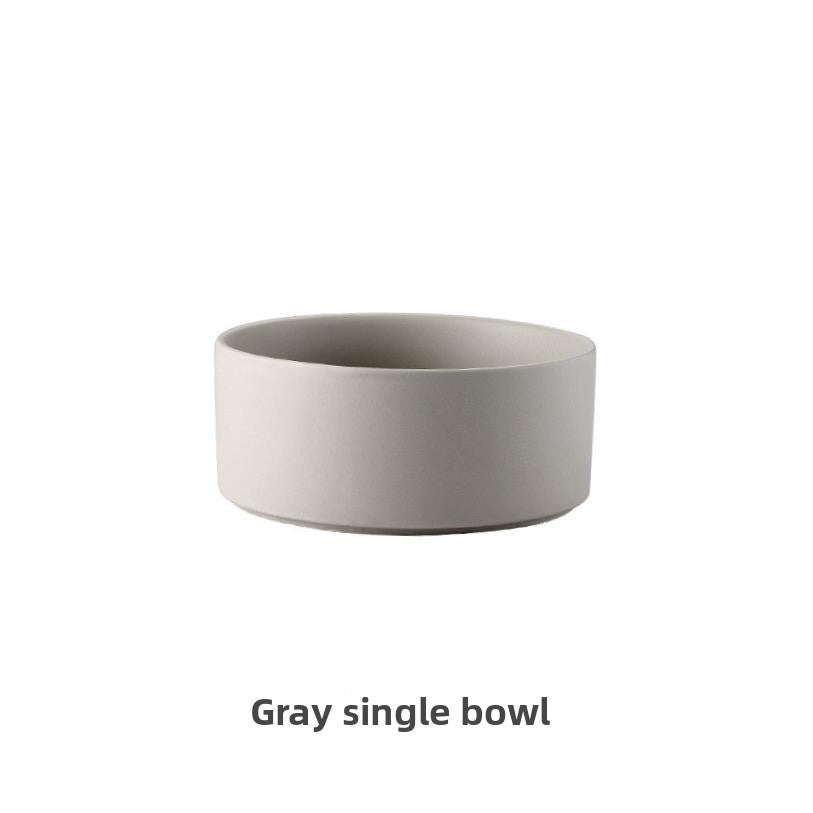 Raised glazed ceramic pet bowl on a stand in pastel yellow, view 12