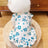 Soft polyester dog vest for autumn and winter in Strawberry, in a home setting