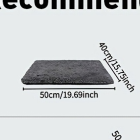 Cat kneading a soft heat-reflective pet bed pad