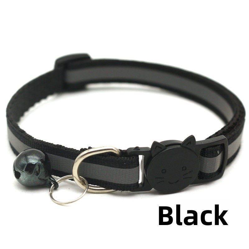Striped reflective cat collar with bell, close-up detail view