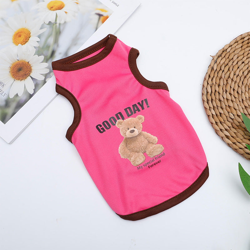 Small dog wearing a light blue striped summer vest