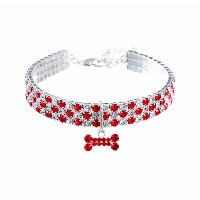 Rhinestone pet collar with bone charm in White, in a home setting