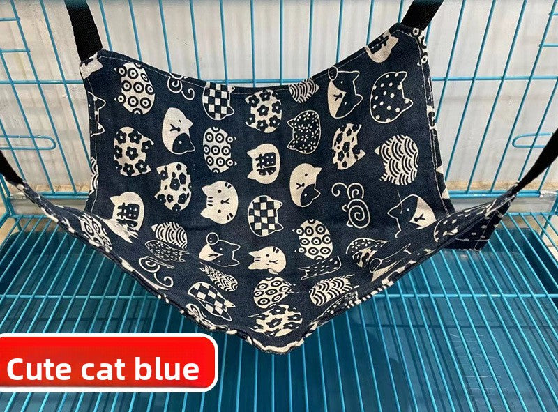 Blue cat print hanging hammock hooked inside a crate