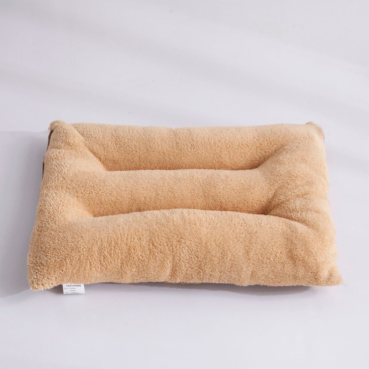 Dog resting on a washable flat bed mat