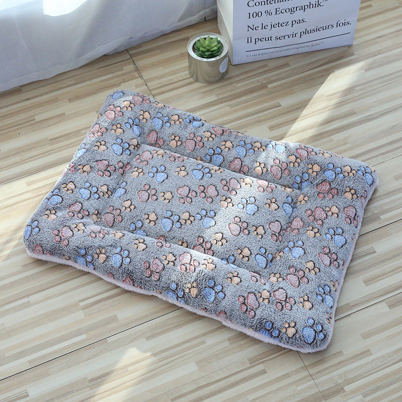 Cat sleeping on a pink rabbit coral fleece blanket