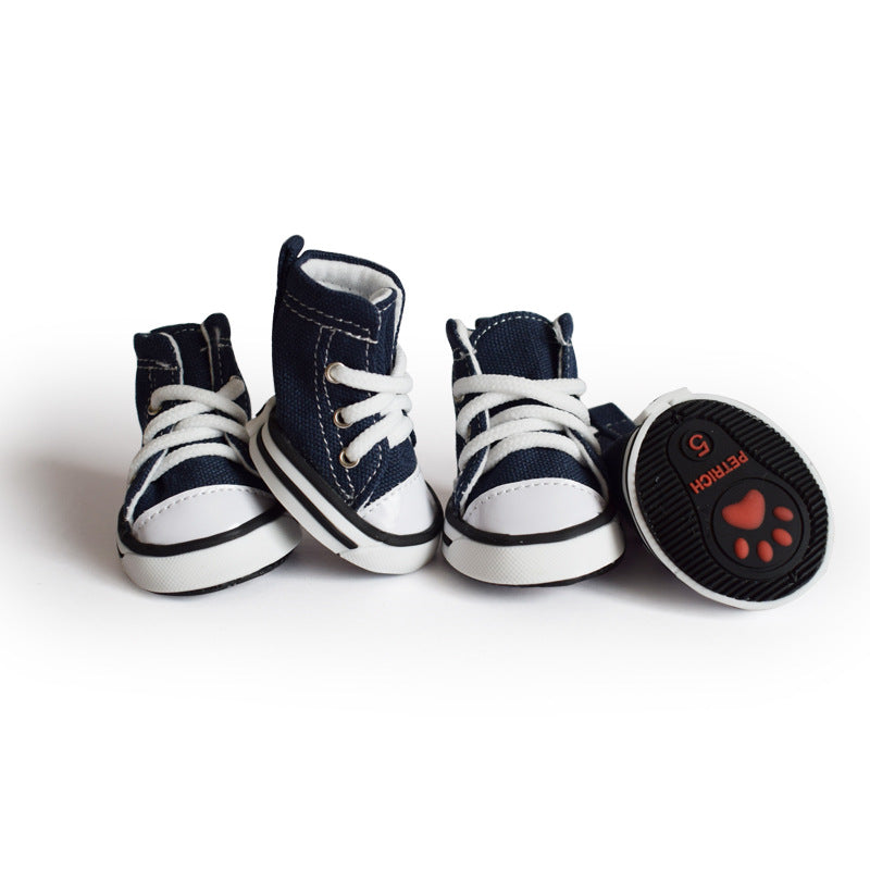 Denim canvas dog shoes with anti-slip sole in Pink, in a home setting