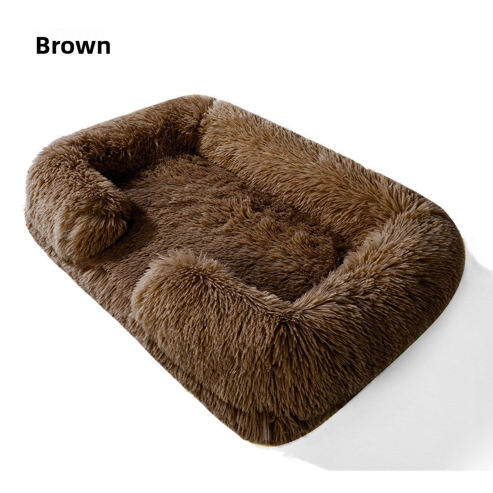 Dog sleeping in a pink square plush bed with cushion