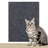 Dark blue cuttable scratch mat protecting a sofa
