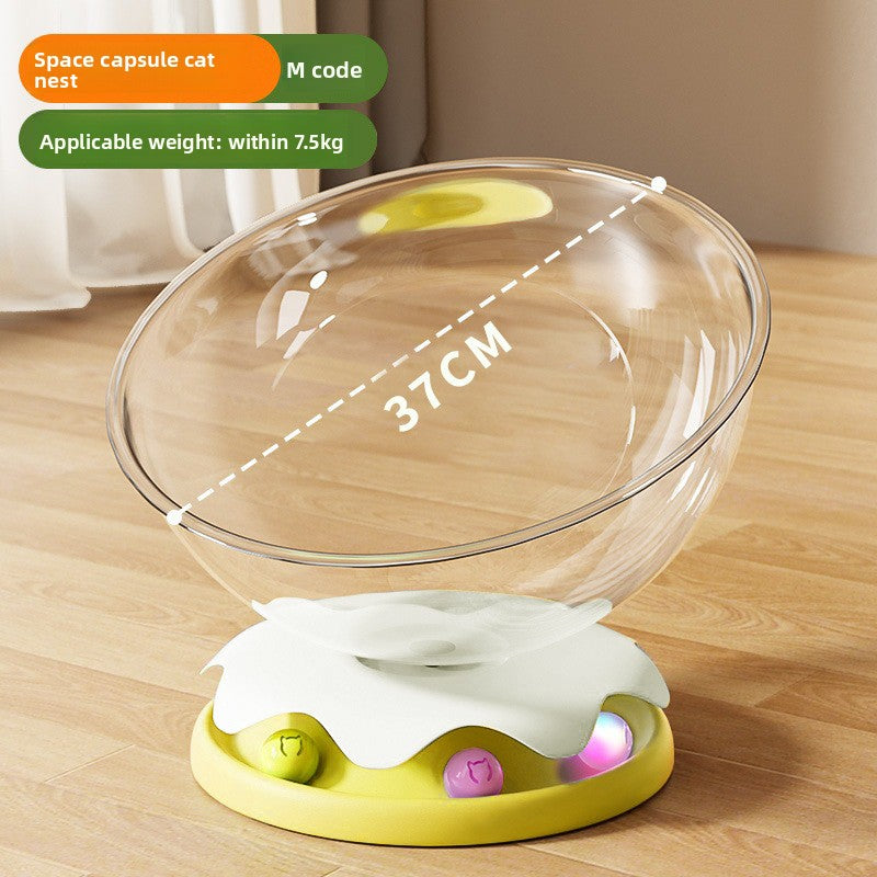Clear capsule cat bed in transparent plastic with cream base, view 9