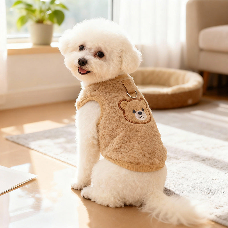 Small dog wearing a cosy blue sherpa fleece bear vest