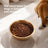 Gold stainless steel pet bowl with football pattern and non slip base, view 2