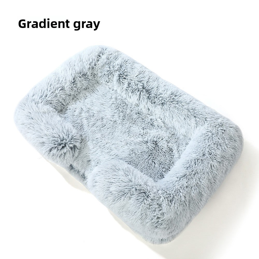Dog sleeping in a pink square plush bed with cushion