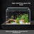 Curved glass goldfish tank on a desk with plants, view 1