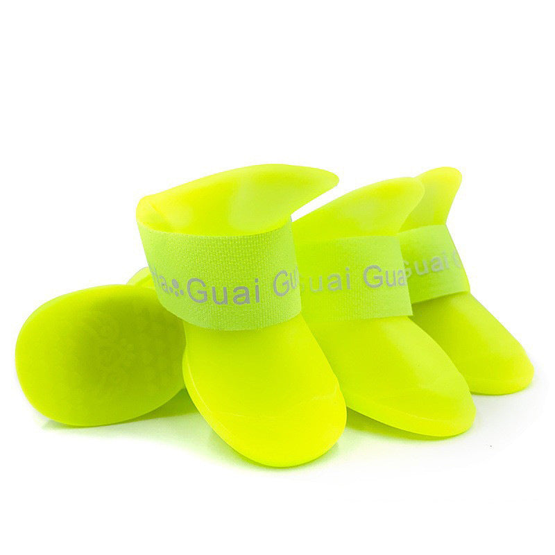 Waterproof silicone dog rain boots with non-slip soles in Green, in a home setting
