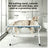 Pet grooming hammock with stand holding a small dog for nail trimming