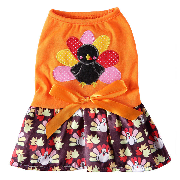 Coral fleece four-leg dog jumpsuit with holiday print, in use with a pet