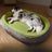 Green oval corduroy pet bed with non-slip base