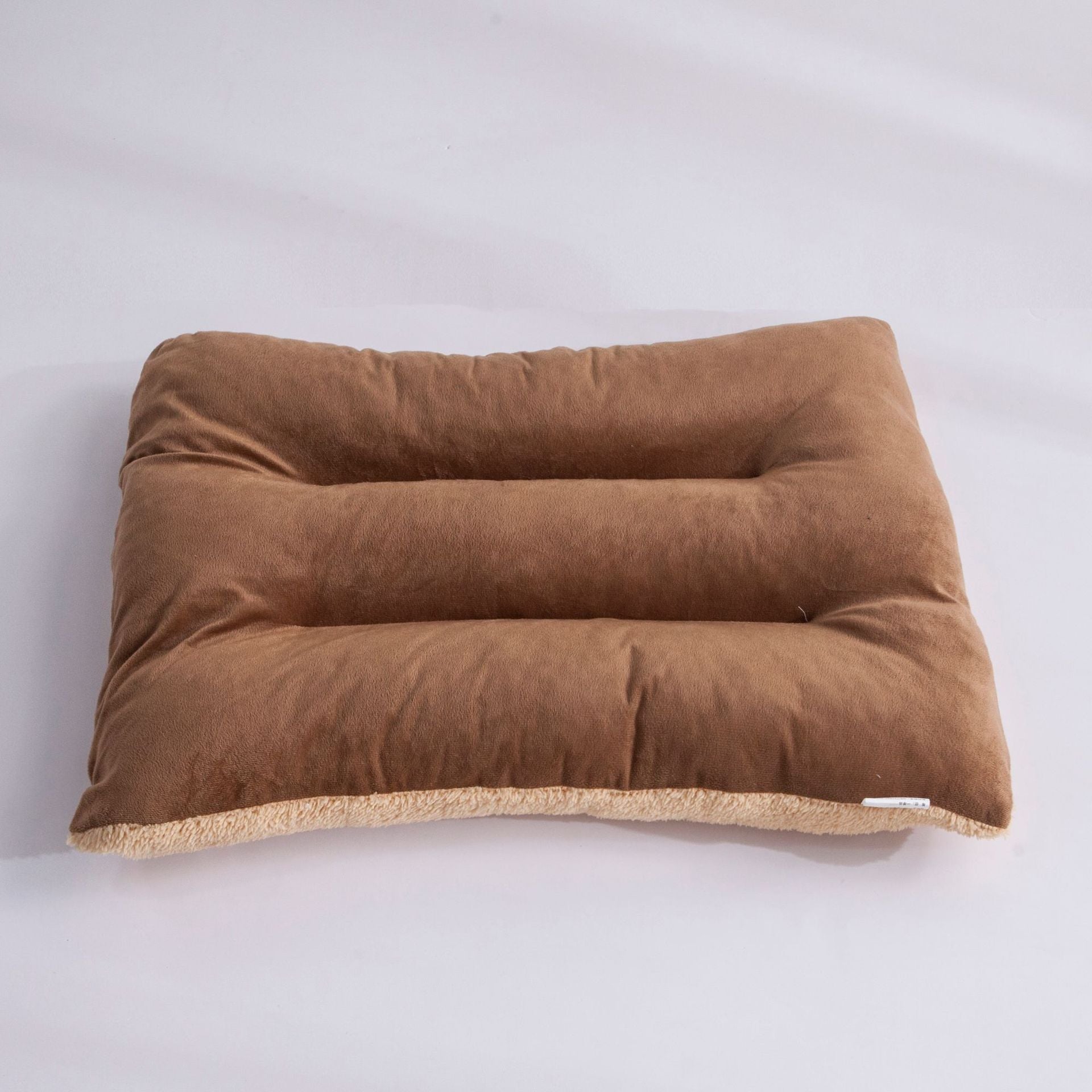 Dog resting on a washable flat bed mat