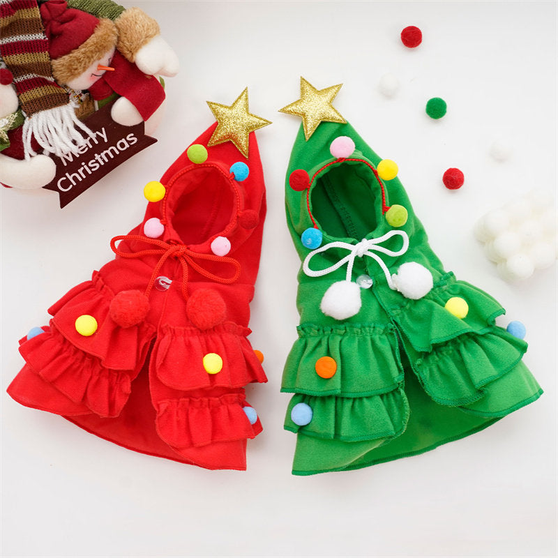 Cat wearing a red Christmas tree pattern cloak