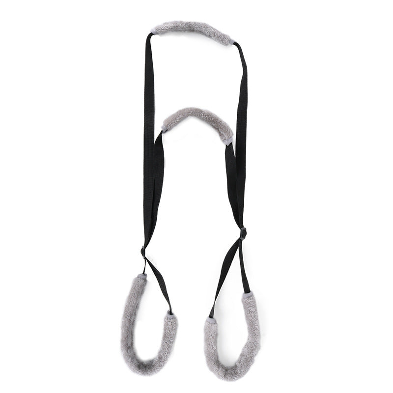 Soft lifting support belt in orange under a small dog