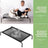 Raised dog cot with iron frame and breathable cover, close-up detail view
