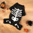 Dog wearing a glow in the dark skeleton costume