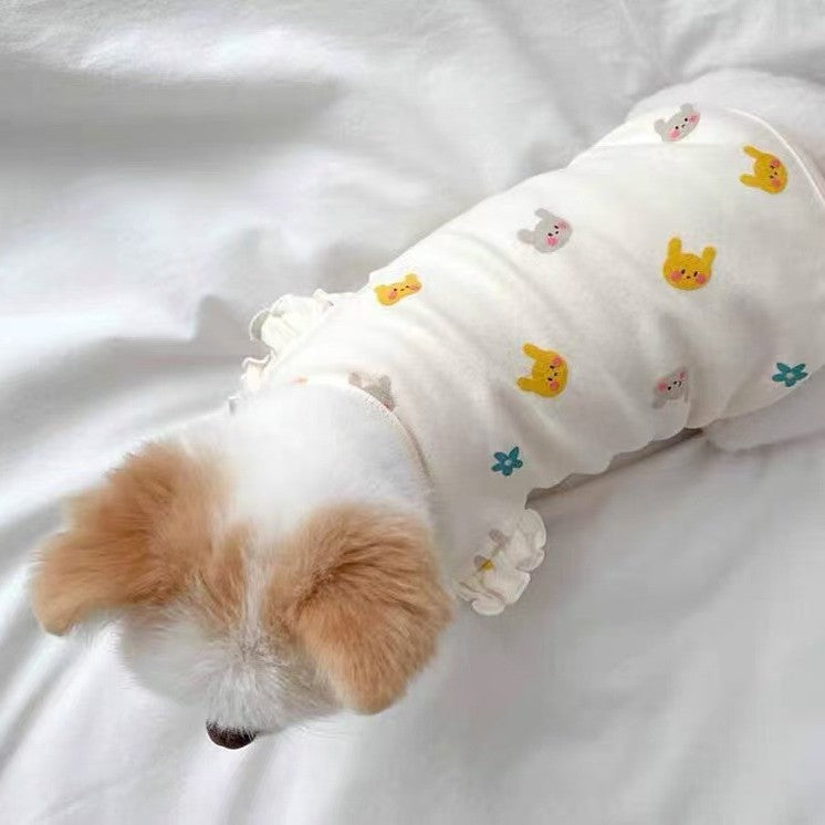 Small dog wearing a pink flutter sleeve vest