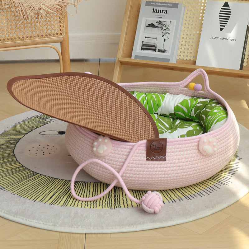 Cat lying in a woven rattan nest with green pad